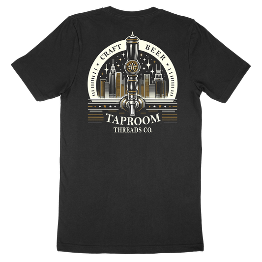 A black crew neck t-shirt with a graphic print of a beer tap and the text 'Craft Beer', 'Taproom Threads Co.', and a city skyline.