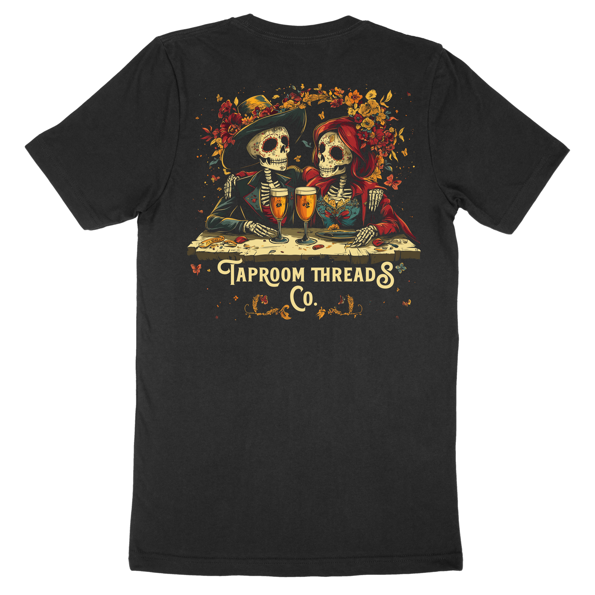 A black t-shirt with a graphic design featuring two skeleton figures, flowers, and the text 'TAPROOM THREADS CO.'